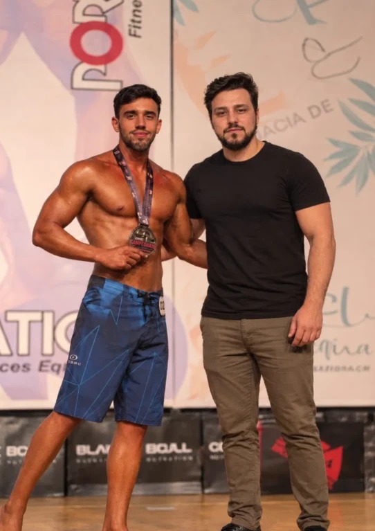 Matheus Altheia, natural Men's Physique champion, with his coach Bruno Camers